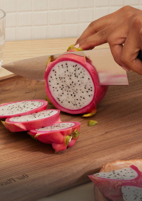 chefs knife cutting fruit