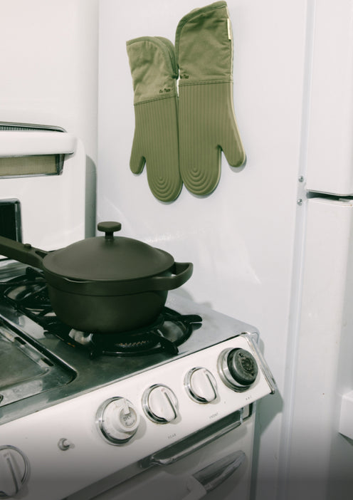 sage hot mitts hanging on fridge