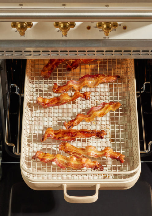 Beige Griddle Pan with oven rack and bacon in oven