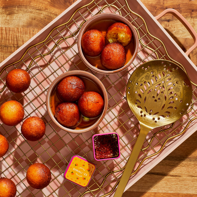 Golden Diwali Fry Set on Griddle Pan with Gulab Jamun