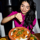 Shiza with carrots on a terracotta dinner plate