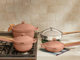 pink perfect pot, mini perfect pot on stove and chrome always pan pro, mini always pan on counter