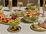green dinnerware assortment serving food on table