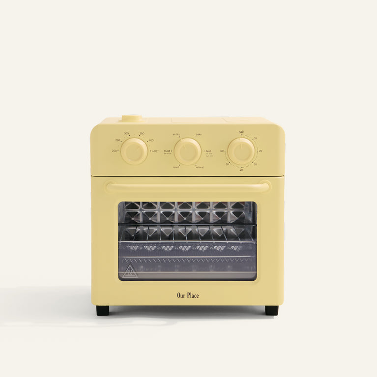 yellow toaster oven on white background