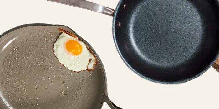 Two pans with an egg inside one of them 