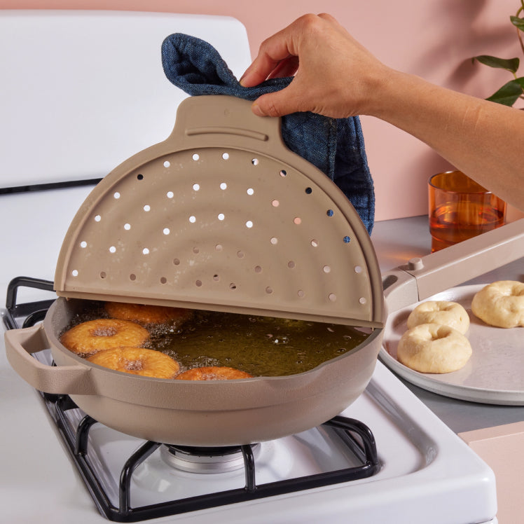 Beige fearless fry open over an always pan frying donuts
