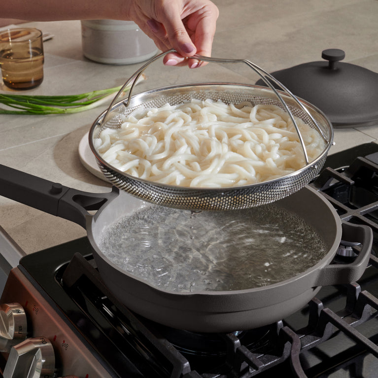 Black-Always-Pan-on-stovetop-with-noodles