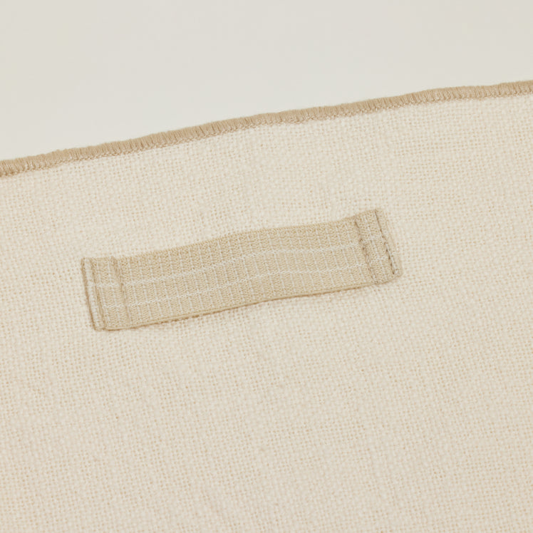 Close up of the built-in ring in a beige Loop Napkin