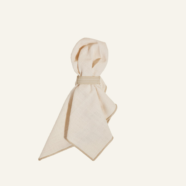 Folded beige Loop Napkins