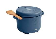 A blue electric rice cooker with a digital display and control buttons on the lid, featuring a wooden spatula resting on the side.
