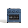 A compact blue countertop convection oven with a glass door and three control knobs on top, shown on a plain white background.
