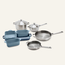 Titanium Pro Cookware + Bakeware Set (2.0) featuring two stainless steel pots with lids, two stainless steel frying pans, and three blue ceramic bakeware dishes.
