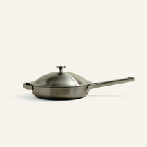 A brushed stainless steel Titanium Always Pan® Pro 26 cm (2.0) frying pan with a matching lid, a long handle, and a small side handle.