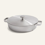 A round Titanium Braiser Pro 28 cm, featuring two handles and a fitted lid, is shown on a plain light background.