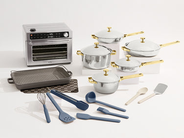 Collection of cookware and kitchen tools including pots, pans, and utensils on a white background.
