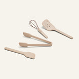 Mini Utensil Essentials: a beige set of 4 silicone tools—tongs, spatula, whisk, and spreader—ideal for any kitchen countertop.