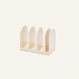 Universal Storage is a beige rectangular organizer with four vertical slots and rounded dividers, ideal for Wonder Oven or cookware storage on any plain surface.