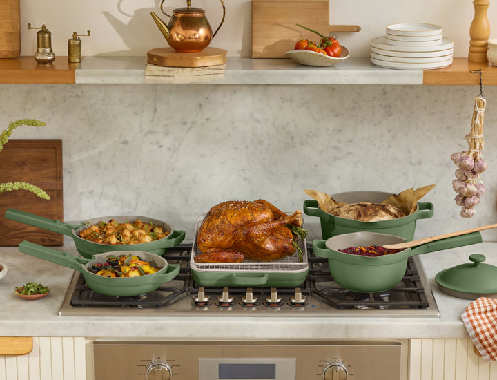 sage always pan, mini always pan, perfect pot, mini perfect pot + griddle pan and oven rack with food on stove