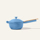 The Ceramic Nonstick Perfect Pot 2.5 L in light blue, featuring a matching lid and a long tan handle, is displayed against a plain off-white background.