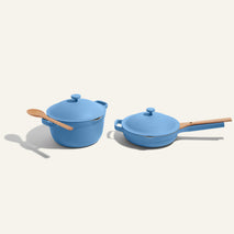 A blue pot and a blue pan on a beige background