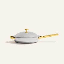 Titanium Always Pan® Pro 26 cm (2.0) stainless steel frying pan with a lid, gold-tone handles, and a long gold-tone handle.