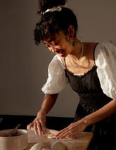 a woman making food