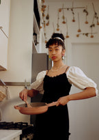 Woman in a kitchen cooking with an Always Pan