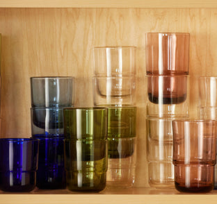 an assortment of colors in night + day glasses in cabinet