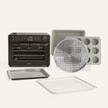 Collection of kitchen baking tools including an oven, trays, and a muffin tin on a white background.