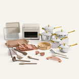 Collection of kitchen utensils and cookware on a white background