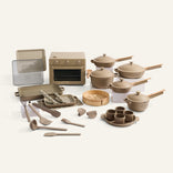 Set of beige kitchen utensils and appliances on a white background