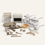 Collection of kitchen utensils and appliances on a white background