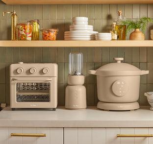 beige wonder oven, splendor blender, and dream cooker on counter