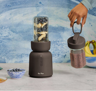 black blender filled with fruit