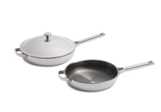 Two stainless steel cookware pieces on a white background: a lidded saucepan with a knob and a second saucepan without a lid, both with long handles.