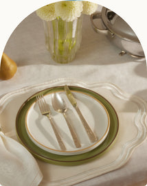 green and white dinnerware assortment on table