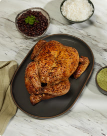 Peruvian Roasted Chicken with Aji Verde on black serving platter