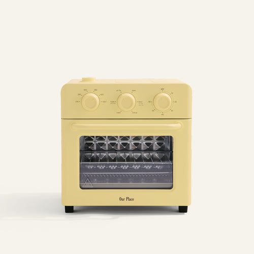 yellow toaster oven on white background