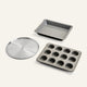 Set of three baking trays including a round perforated tray, a square tray, and a muffin tray on a white background.