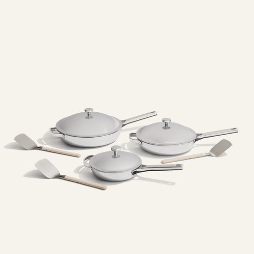 chrome titanium large always pan pro, always pan pro, and mini always pan pro with stainless steel spatulas