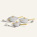 gold titanium large always pan pro, always pan pro, and mini always pan pro with stainless steel spatulas