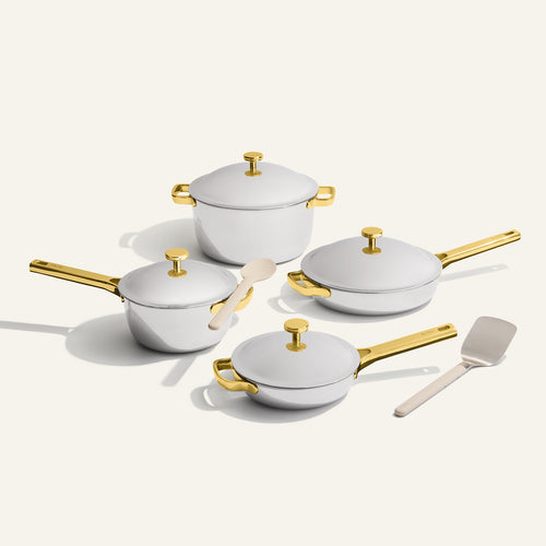 gold titanium perfect pot pro, always pan pro, mini perfect pot pro, and mini always pan pro with silicone spoon and stainless steel spatula