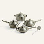 Set of stainless steel cookware with lids on a white background