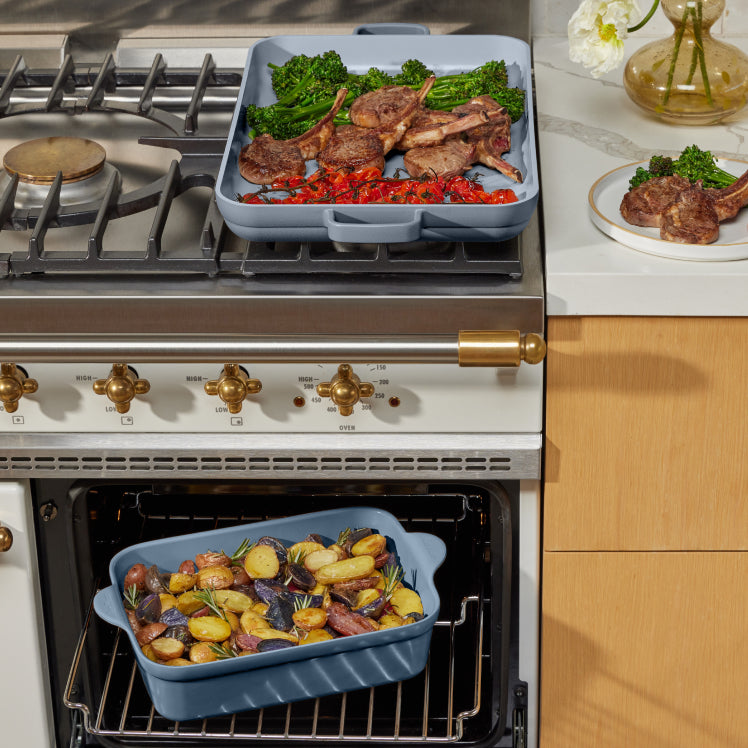 blue griddle pan on stove and blue baker in oven