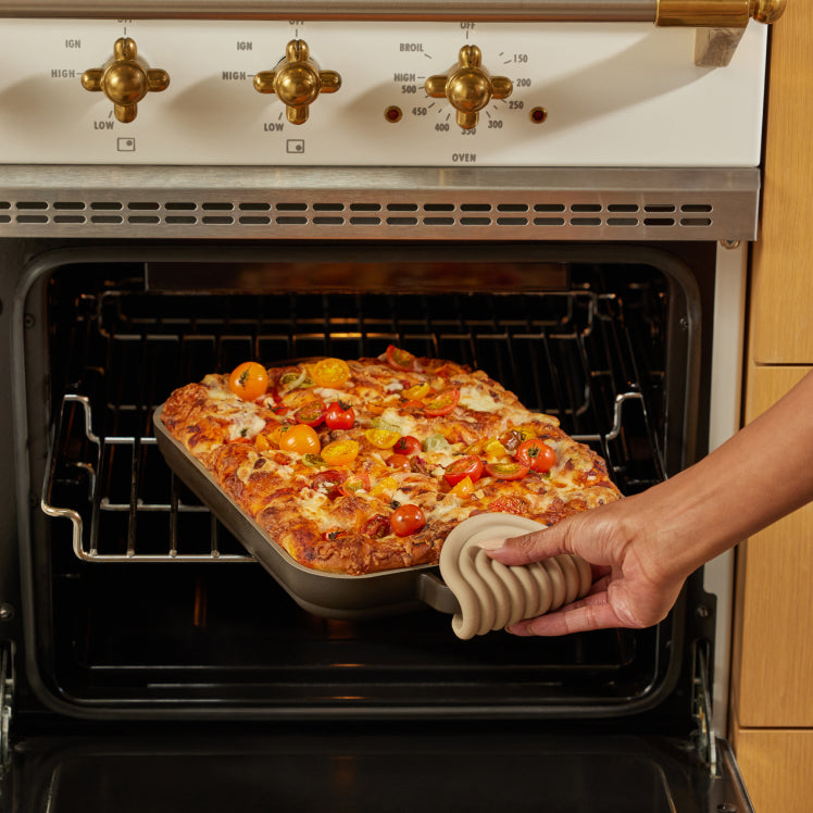 black griddle pan baking bread in oven