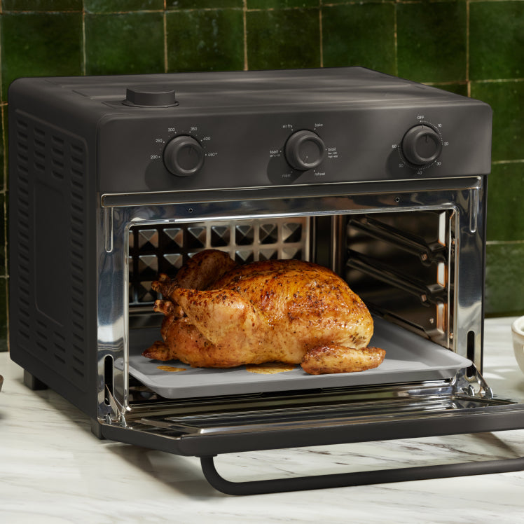 baking chicken in black large wonder oven on counter