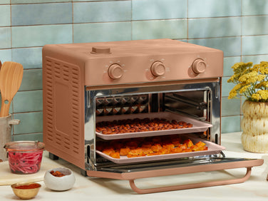 pink large wonder oven on counter