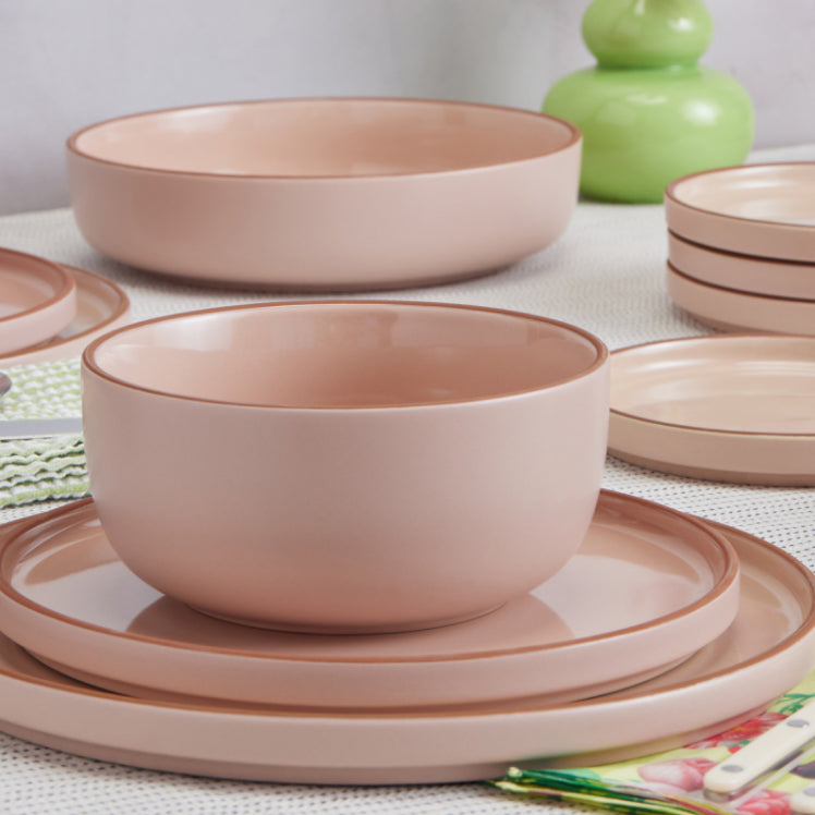 pink soup bowl, salad plate and dinner plate on table