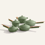 The Cookware Set+ includes four green nonstick ceramic pieces with matching lids and wooden handles, showcased on a light background.
