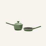 The Tiny Cookware Duo features two green pans—a lidded saucepan and a frying pan, each with long handles—displayed side by side on a plain light background.